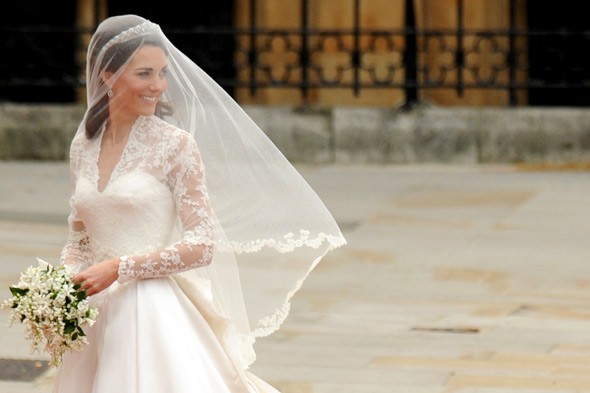 Her bridal look included a full veil a Cartier tiara borrowed from the 